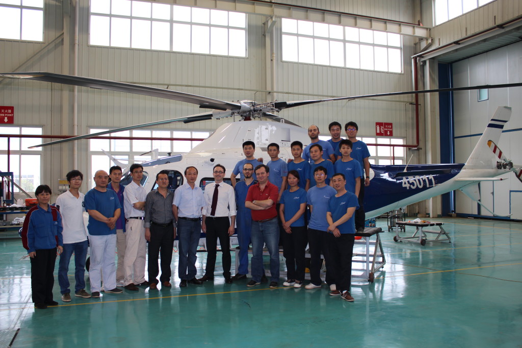 Angelo Cecchini (centre) with his team, image courtesy of AgustaWestland