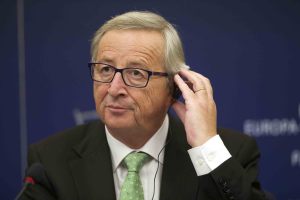 Jean-Claude Juncker, fixing his audio helmet